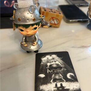 Silver and Green Figurine with Card